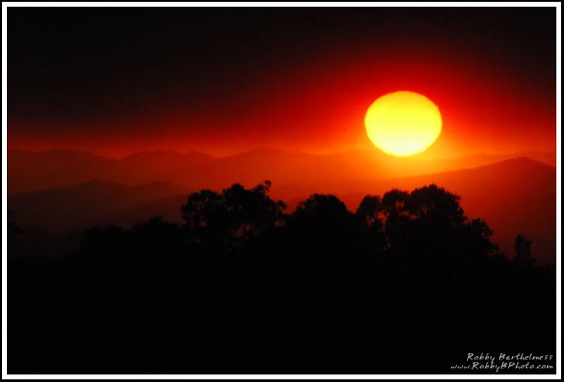 The sun glowing red through smoke from the Zaca Fire