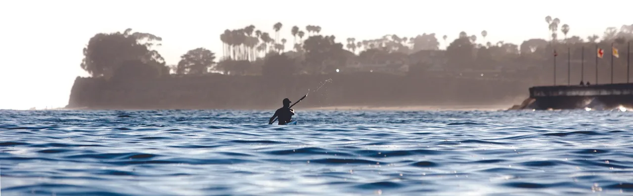A lone paddler on the water off the Santa Barbara coast