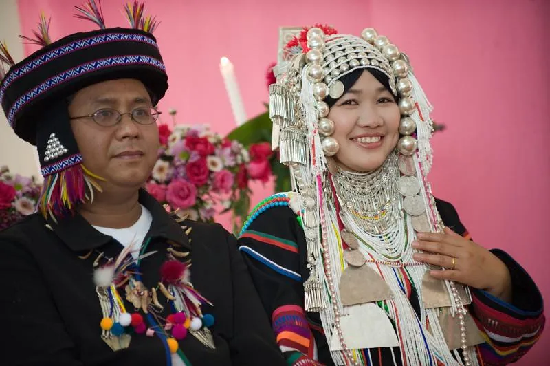 An Akha bride and groom in traditional dress at their wedding, northern Thailand