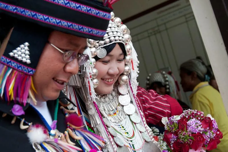 An Akha bride and groom smiling during their wedding ceremony, northern Thailand
